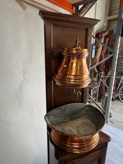 Copper fountain on a molded oak display cabinet....