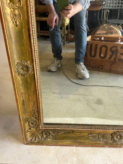 Large wooden mirror with stuccoed and gilded...