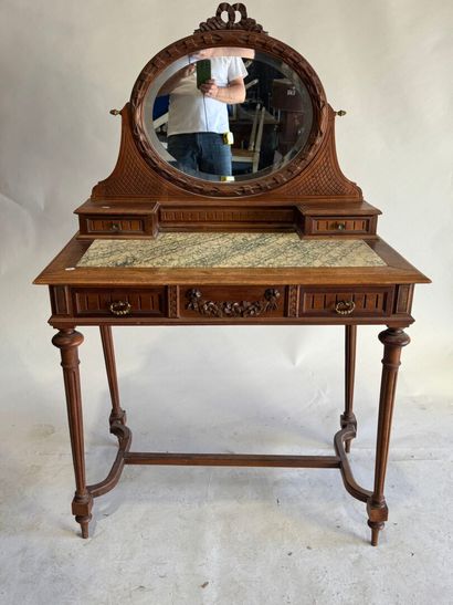 Walnut dressing table with an oval mirror,...