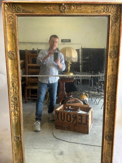 Large wooden mirror with stuccoed and gilded...