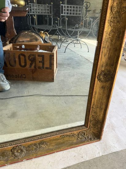 Large wooden mirror with stuccoed and gilded...