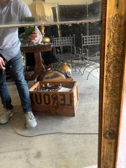 Large wooden mirror with stuccoed and gilded...