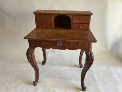 Stepped oak desk with four drawers and a...