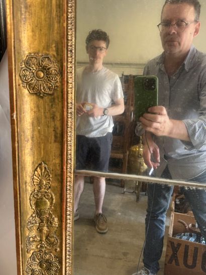 Large wooden mirror with stuccoed and gilded...