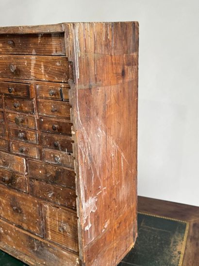 Small wooden craft cabinet opening with 27...