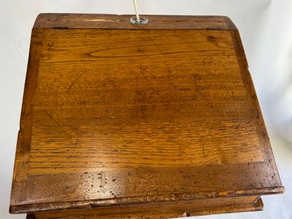 Wooden lectern opening to a flap forming...