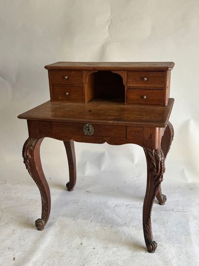 Stepped oak desk with four drawers and a...