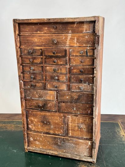 Small wooden craft cabinet opening with 27...