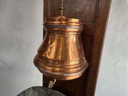 Copper fountain on a molded oak display cabinet....