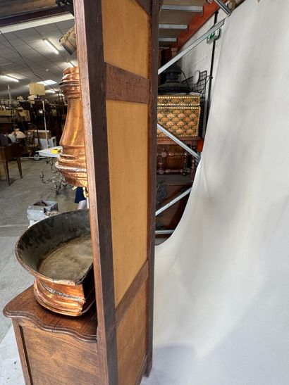 Copper fountain on a molded oak display cabinet....