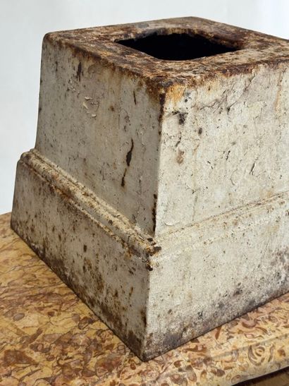 Cast-iron base, formerly lacquered white....