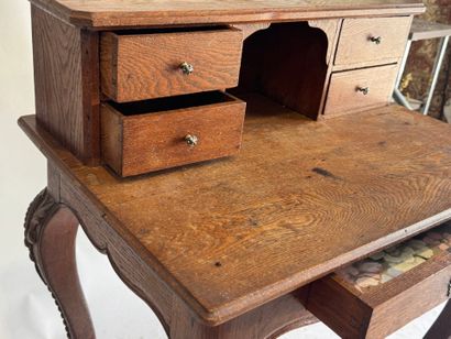 Stepped oak desk with four drawers and a...