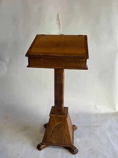 Wooden lectern opening to a flap forming...