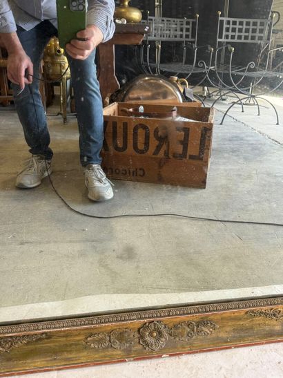 Large wooden mirror with stuccoed and gilded...