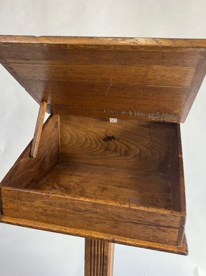 Wooden lectern opening to a flap forming...