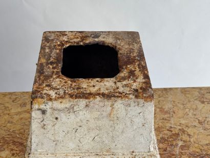 Cast-iron base, formerly lacquered white....