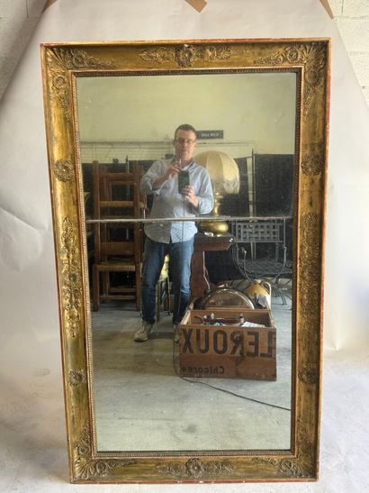 Large wooden mirror with stuccoed and gilded...