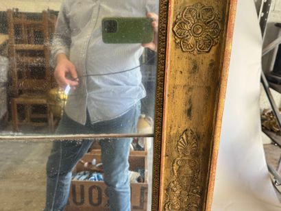 Large wooden mirror with stuccoed and gilded...