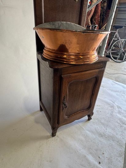 Copper fountain on a molded oak display cabinet....