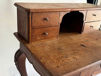 Stepped oak desk with four drawers and a...