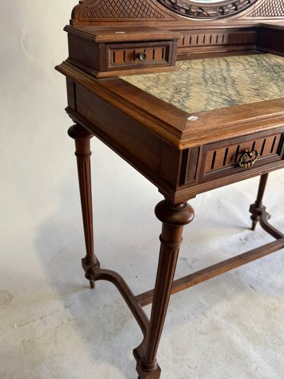 Walnut dressing table with an oval mirror,...
