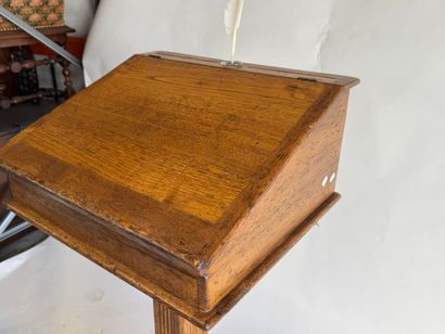 Wooden lectern opening to a flap forming...