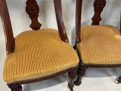Set of three chairs in carved molded wood,...