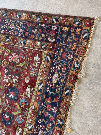 Small hand-knotted woollen rug with polychrome...