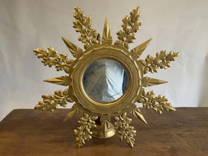 Circular view mirror in gilded wood, with...