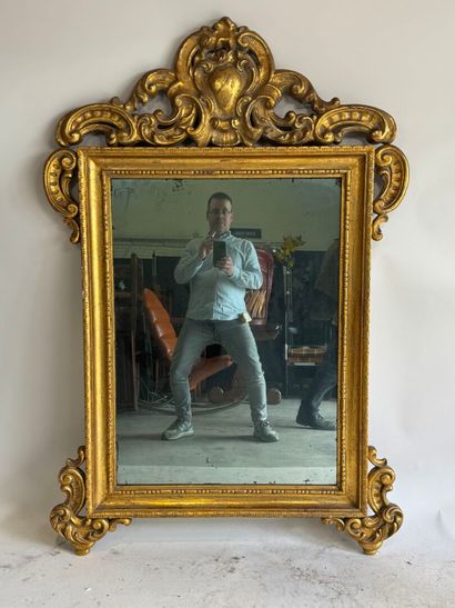 Rectangular wood and gilded stucco mirror...