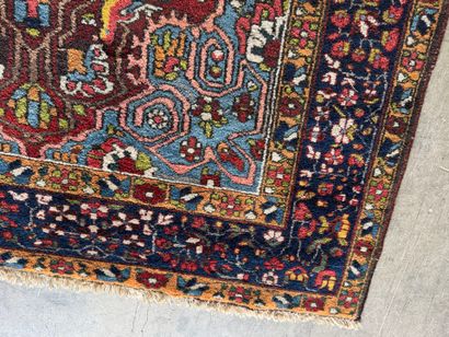 Small hand-knotted woollen rug with polychrome...