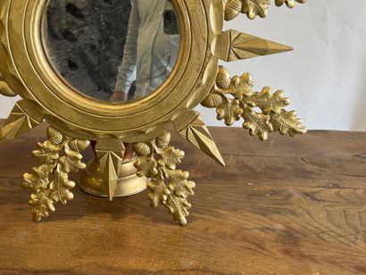 Circular view mirror in gilded wood, with...