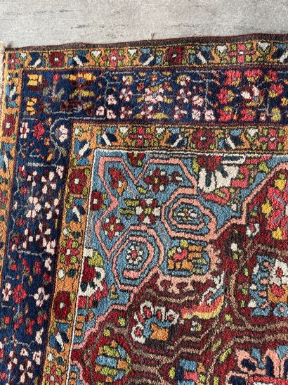 Small hand-knotted woollen rug with polychrome...