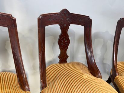 Set of three chairs in carved molded wood,...