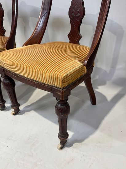 Set of three chairs in carved molded wood,...