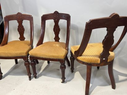 Set of three chairs in carved molded wood,...