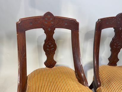 Set of three chairs in carved molded wood,...