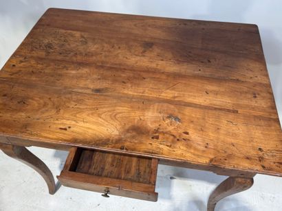 Natural wood writing table opening with a...