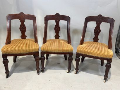 Set of three chairs in carved molded wood,...