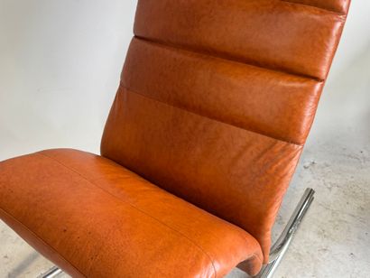 Rocking chair in skai, the base in tubular...