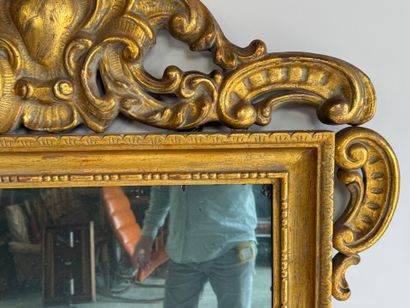 Rectangular wood and gilded stucco mirror...