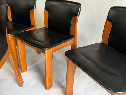 Set of four chairs in stained wood and black...