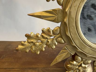 Circular view mirror in gilded wood, with...
