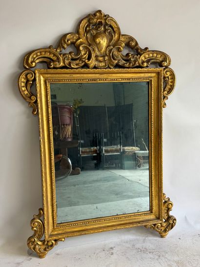 Rectangular wood and gilded stucco mirror...