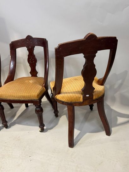 Set of three chairs in carved molded wood,...