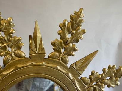 Circular view mirror in gilded wood, with...