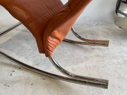 Rocking chair in skai, the base in tubular...