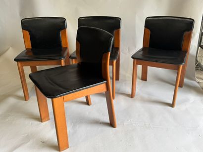 Set of four chairs in stained wood and black...