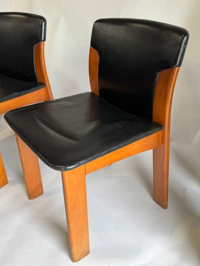 Set of four chairs in stained wood and black...
