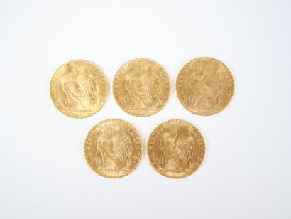 Ensemble de cinq pièces de 20 francs en or,...